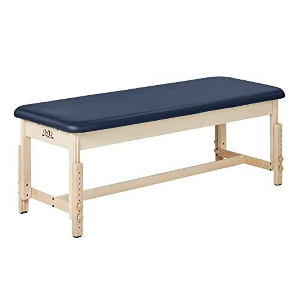Stationary treatment table with dark blue upholstery and light wood side supports