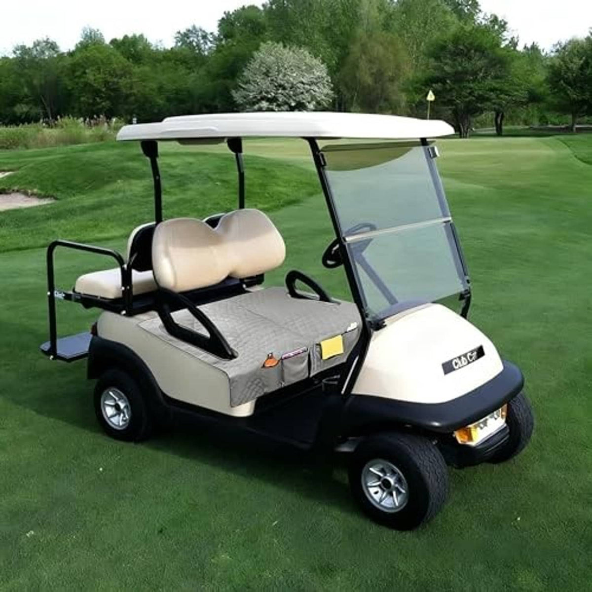 Light-colored golf cart seat with gray quilted cover and side storage pouch