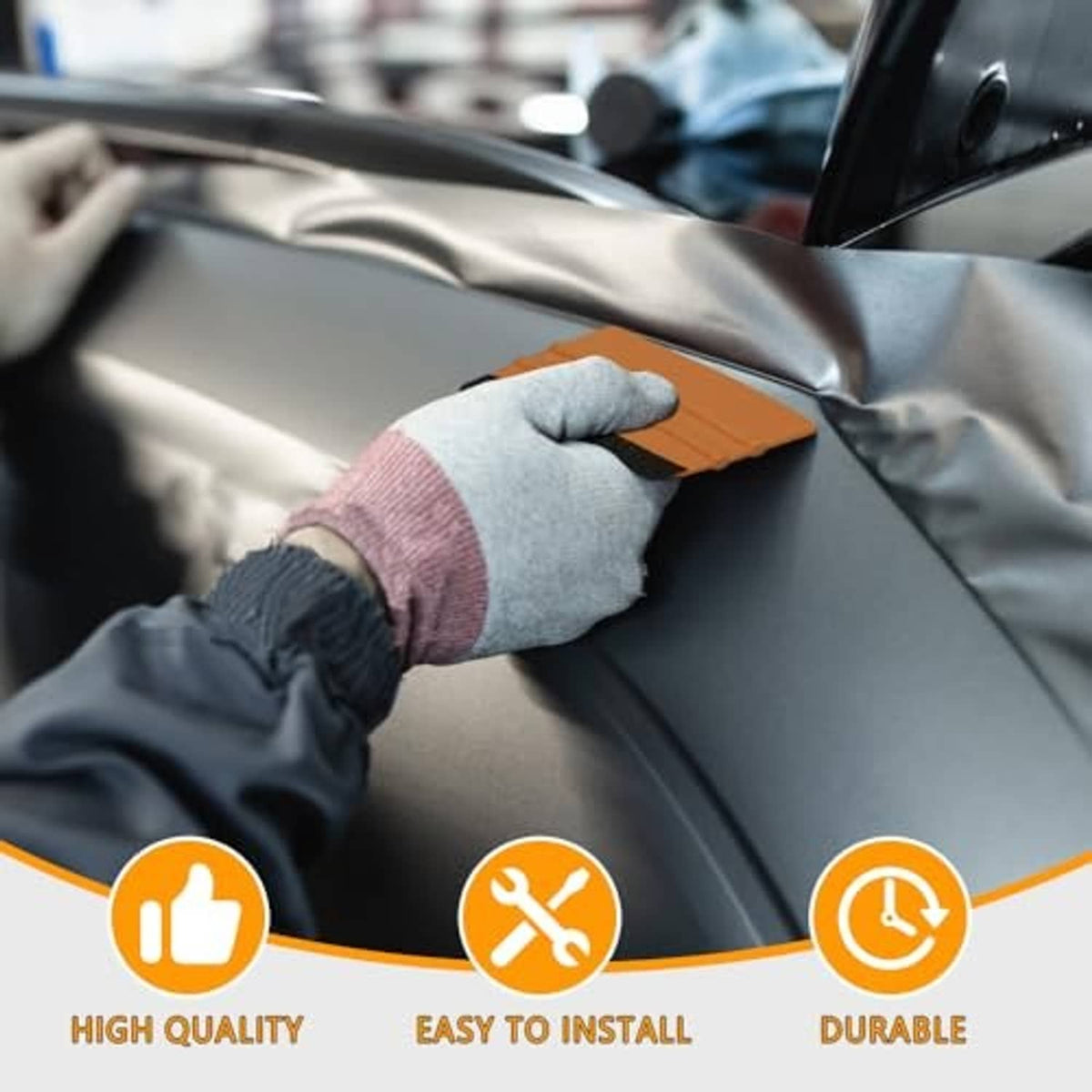 Vinyl squeegee with orange handle and black felt edge, smoothing car interior film