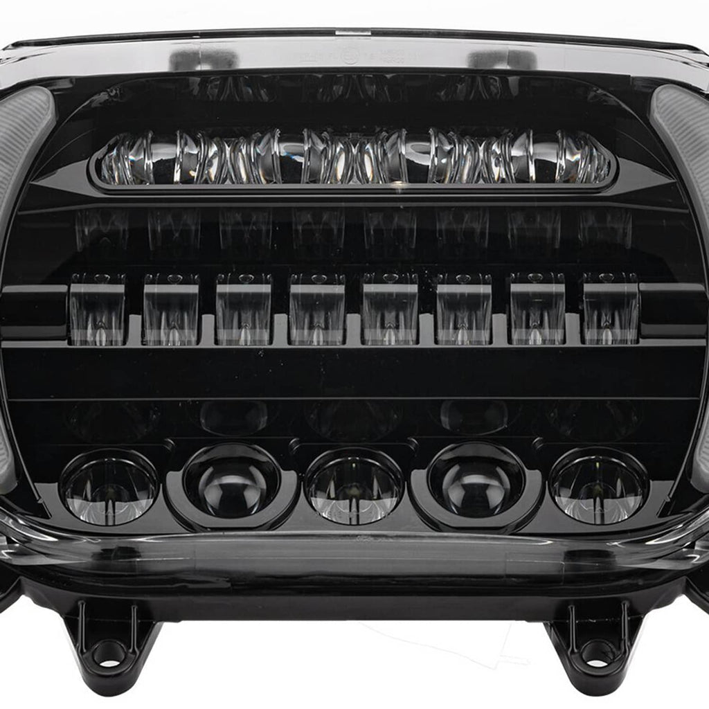 Close-up of LED headlight lens showing bright LED bars and circular projector bulbs