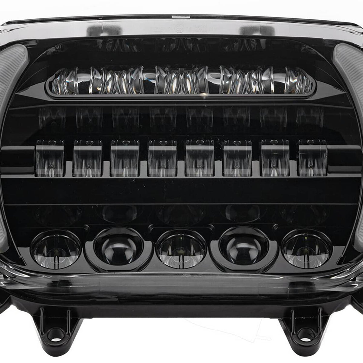 Close-up of LED headlight lens showing bright LED bars and circular projector bulbs