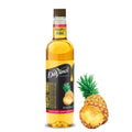 DaVinci Gourmet pineapple syrup bottle with pineapple fruit beside it