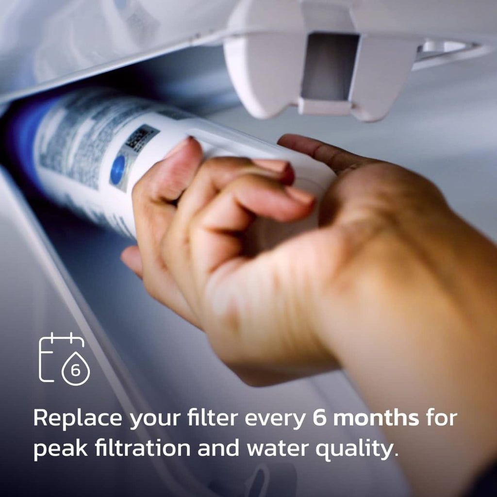 White refrigerator water filter cartridge being installed by hand