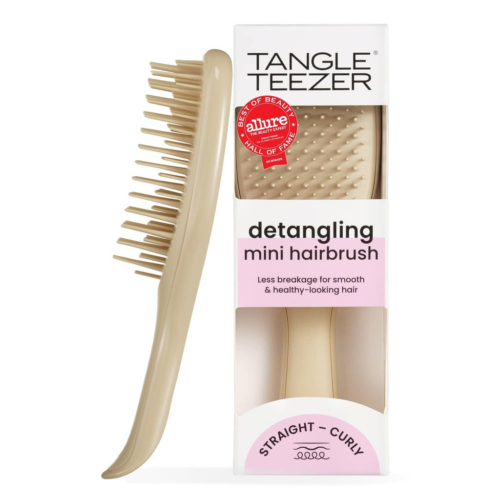 Mini detangling hair brush with cream handle and two-tier teeth, in retail box