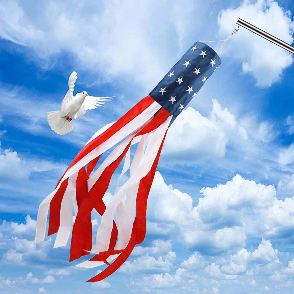 US flag windsock with blue stars and red-and-white stripes near a white dove decoration
