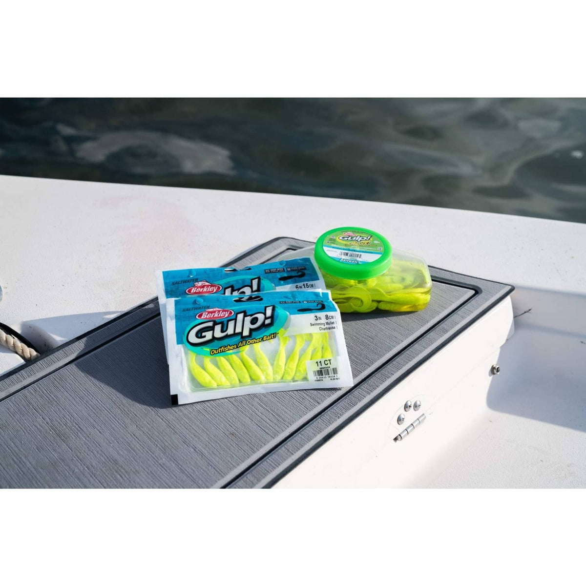Gulp! soft bait pack with green container placed on a boat deck