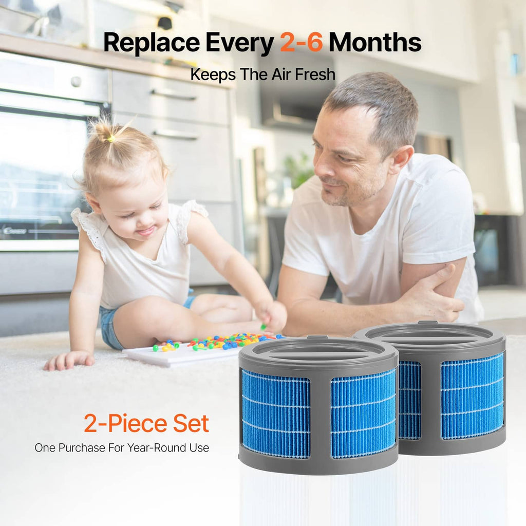 Two blue evaporative humidifier replacement filter cartridges with grey bases