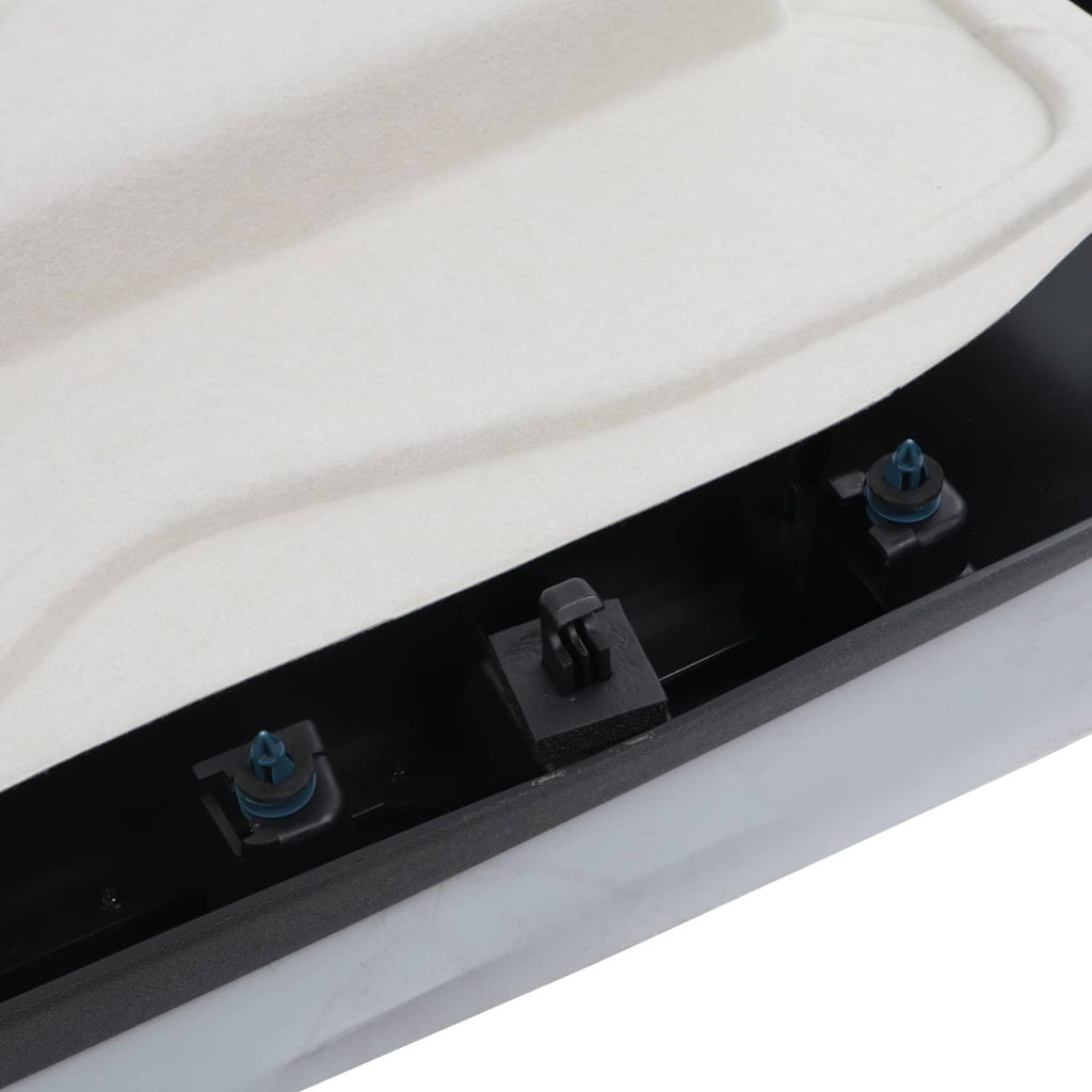 Row of inner door trim clips and plastic retainers along the edge on light backing.