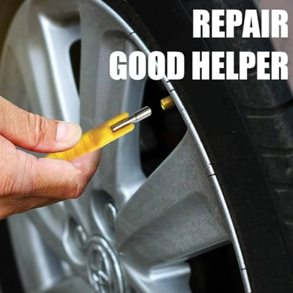 Hand using yellow valve stem puller on wheel valve area with metal tip