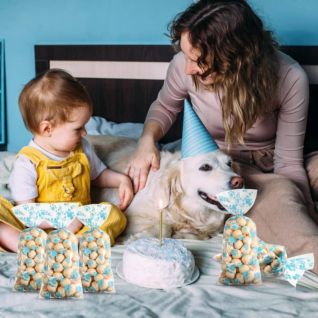 Blue paw-print dog treat cellophane bags with heat-seal crimped tops and bow ties