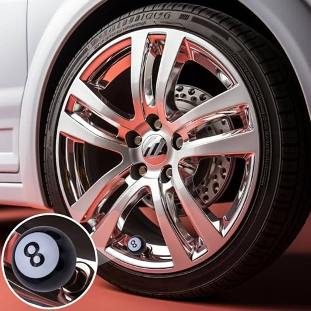 Black 8-ball tire valve stem cap with white 8 icon on car wheel