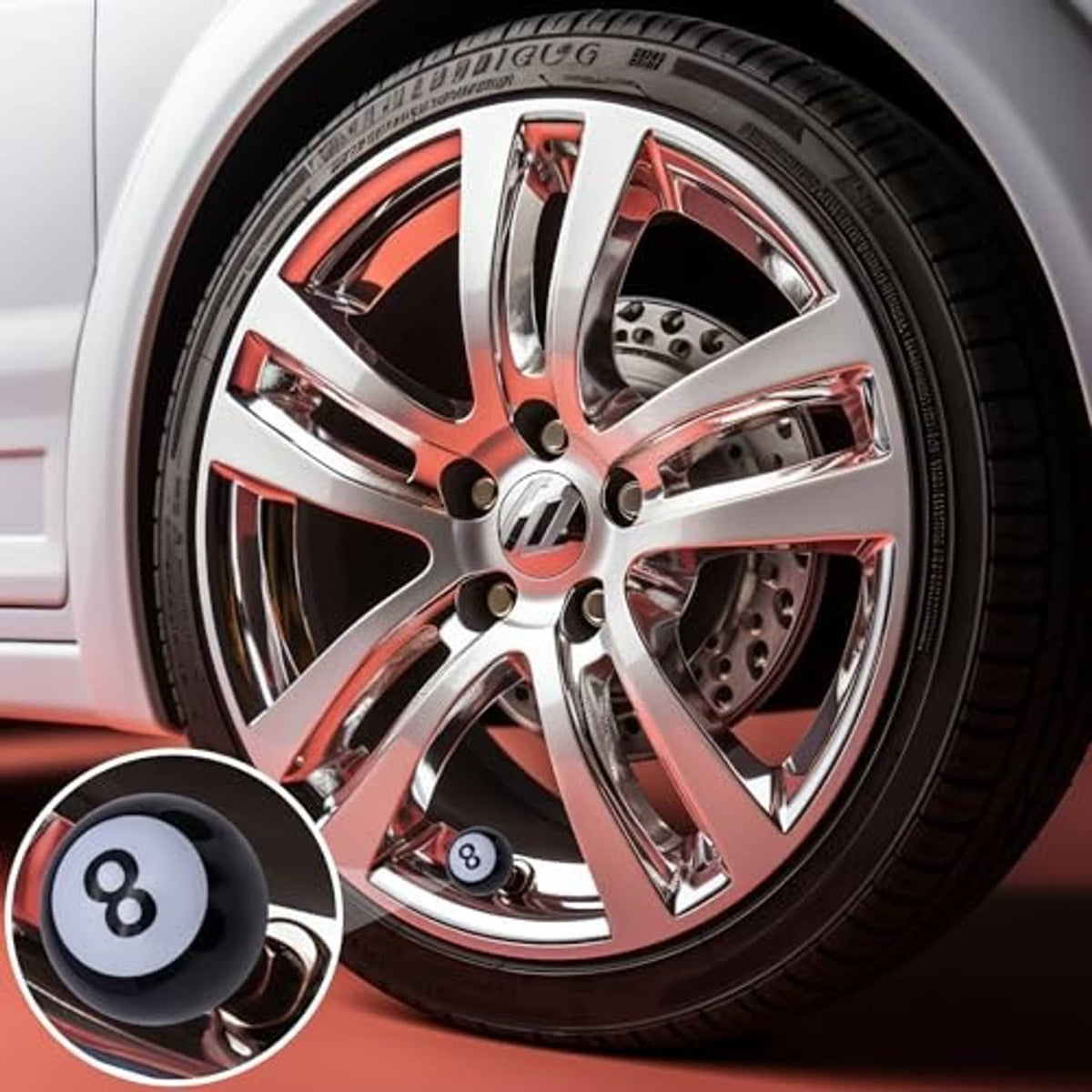 Black 8-ball tire valve stem cap with white 8 icon on car wheel