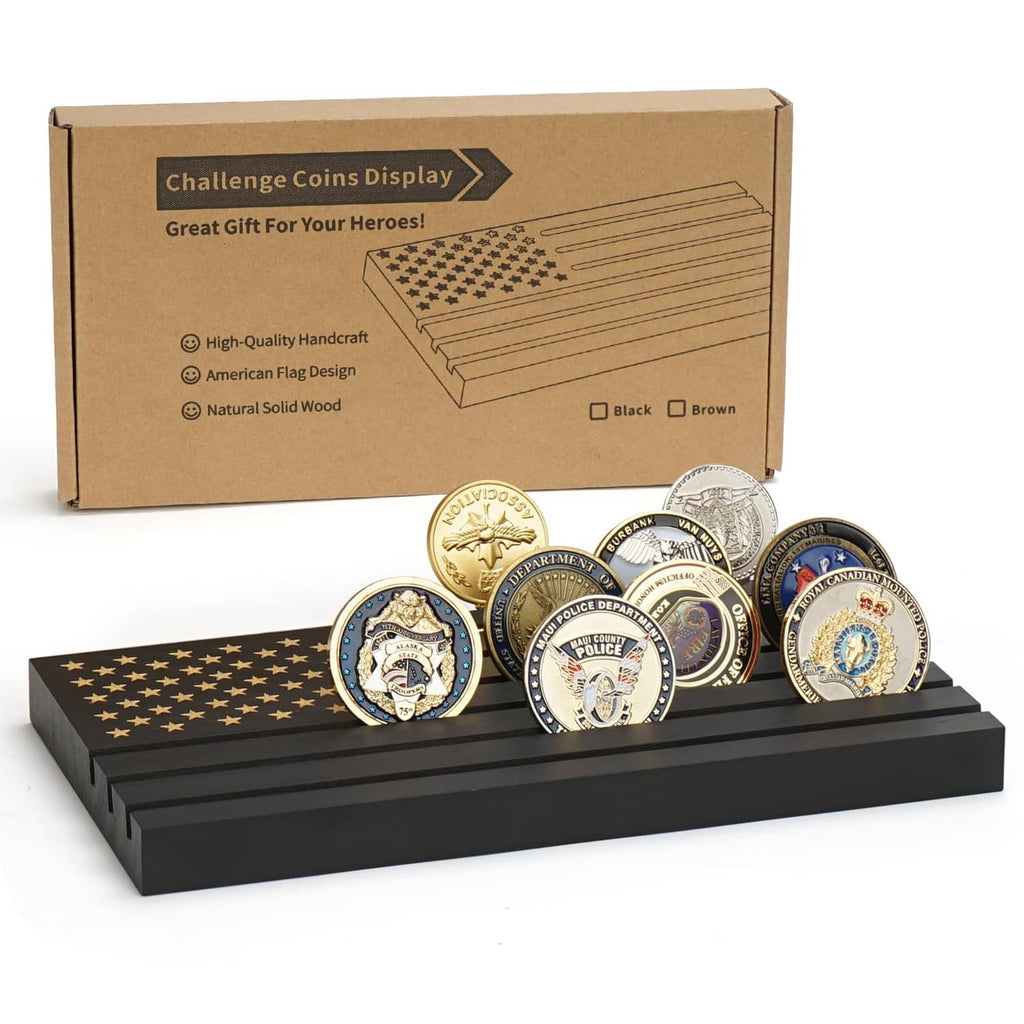Black wooden coin display stand with five challenge coins on top