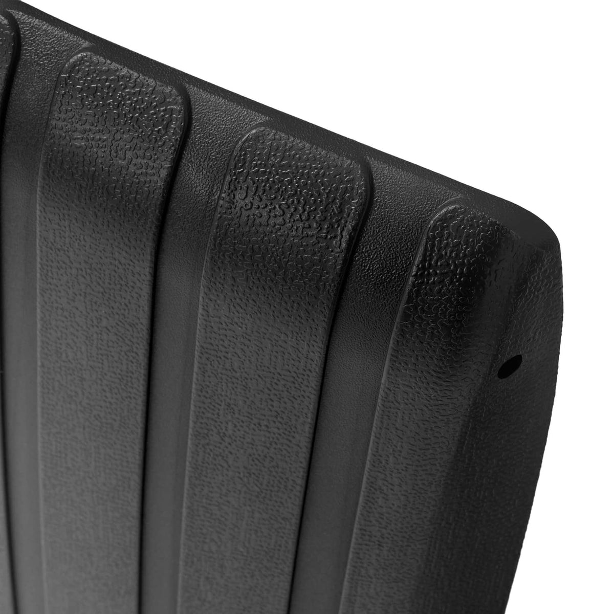 Close-up of black ribbed scuff guard texture with raised ridges