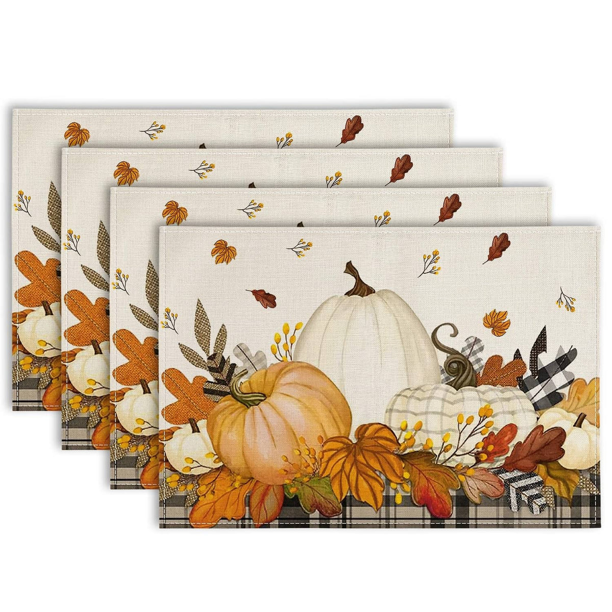 Stack of beige autumn placemats with pumpkins, flowers, and leaf print