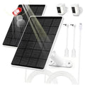 Two black solar panels with white camera mounts and bundled USB-C cables