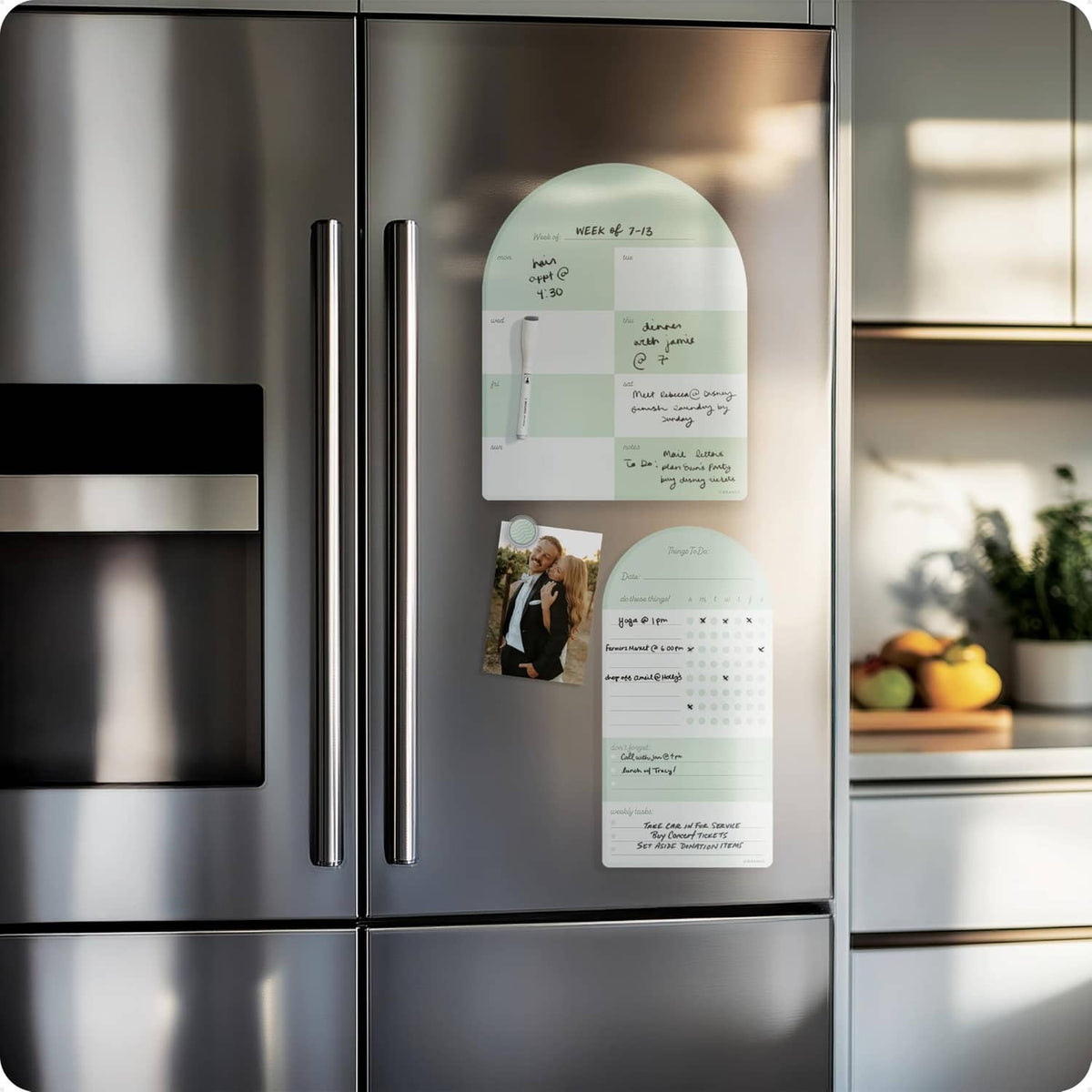 Sage green magnetic calendar planner with checklist and weekly pages on refrigerator