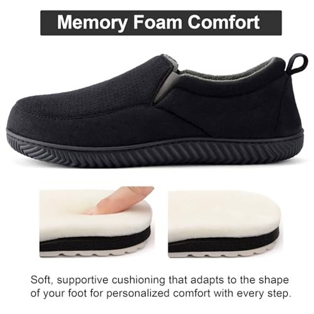 Black slip-on memory foam comfort slippers with thick cushioned sole, front view.