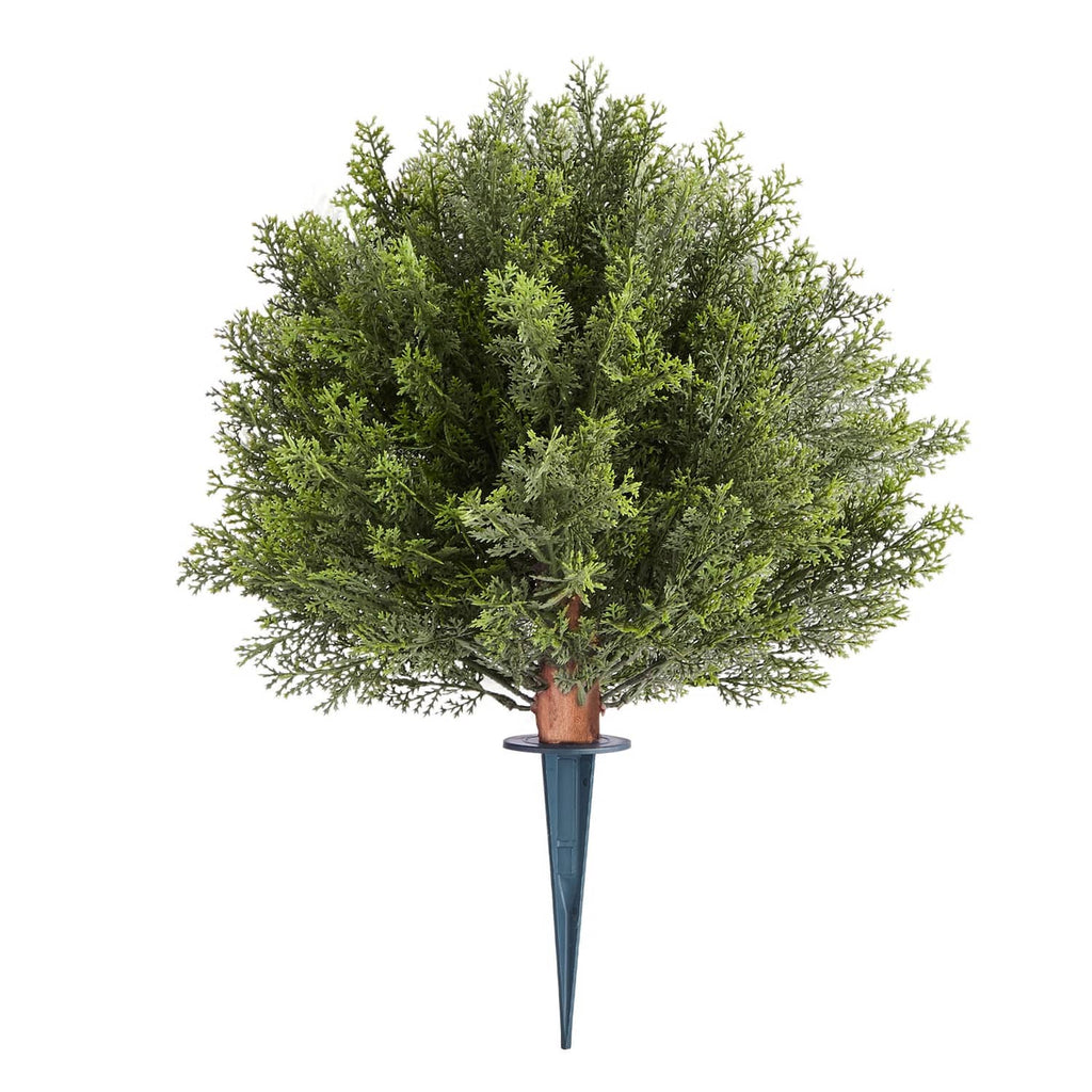 Single artificial cypress topiary tree with dense green foliage, brown trunk, blue ground spike