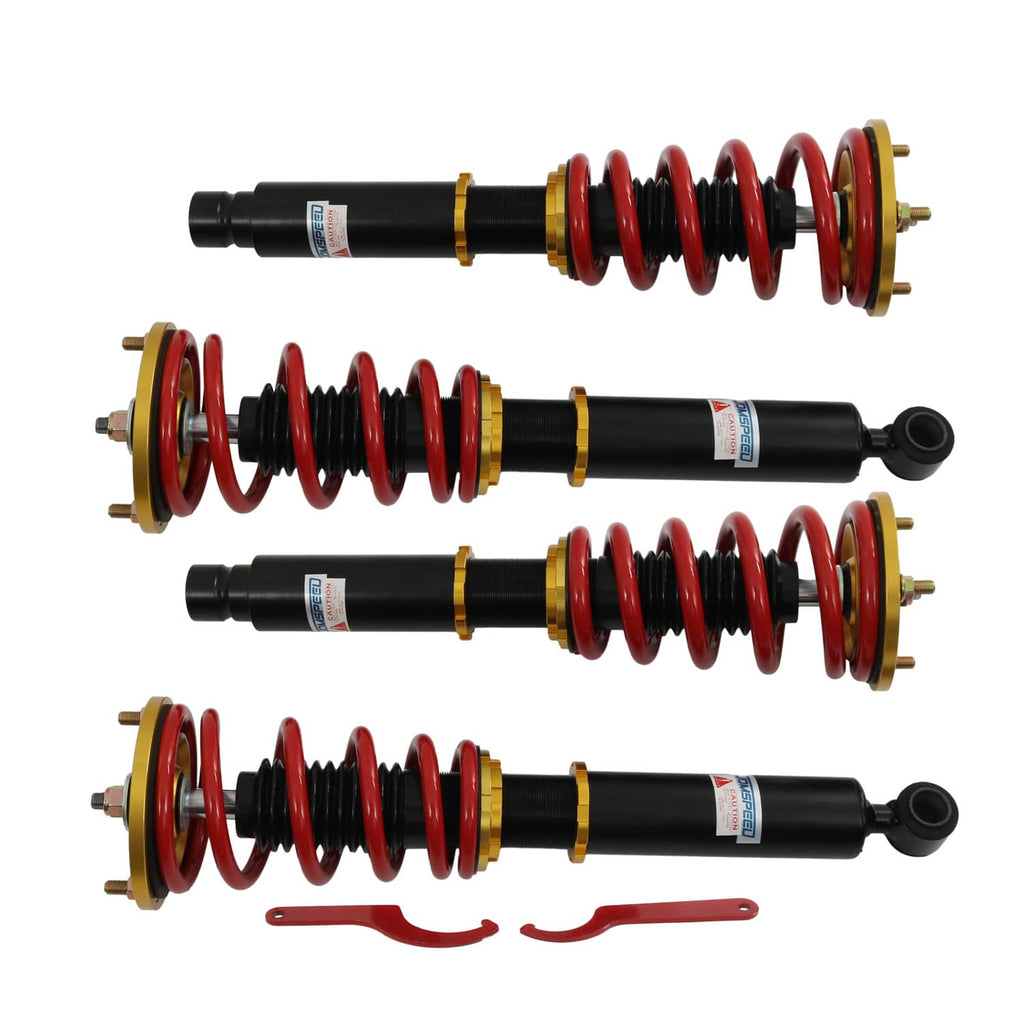 Coilover shock suspension set of four with red coil springs on black dampers and gold rings