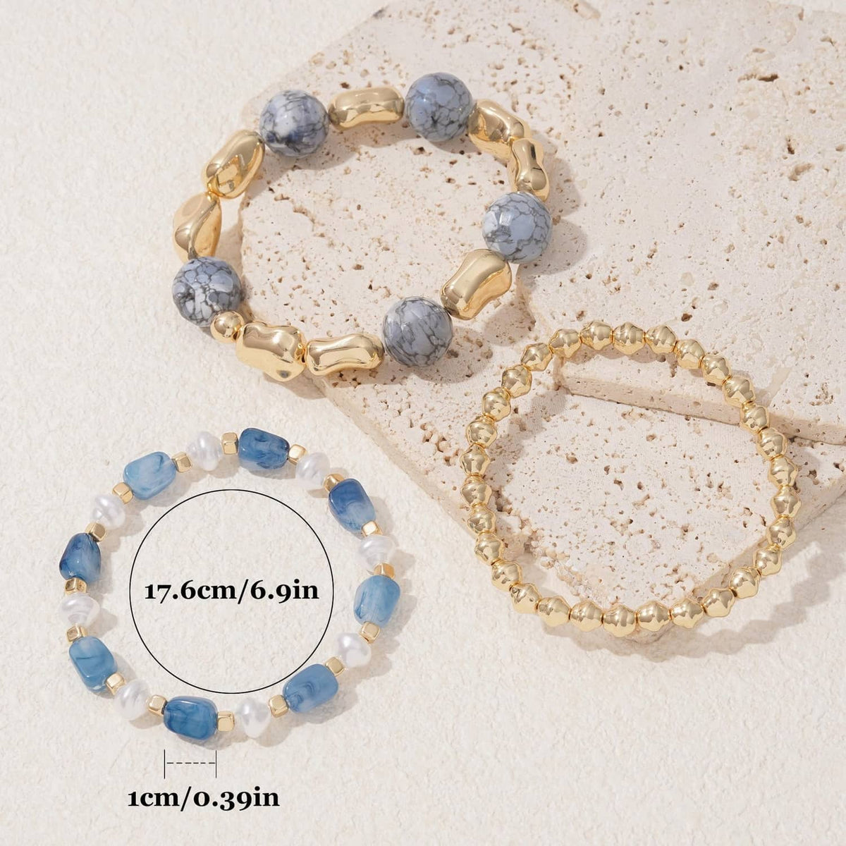 3 beaded stretch bracelets in blue, gray, and gold with chunky bar and round beads