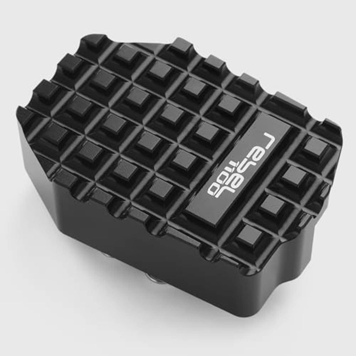 Black rear brake pedal extension block with angled textured tread