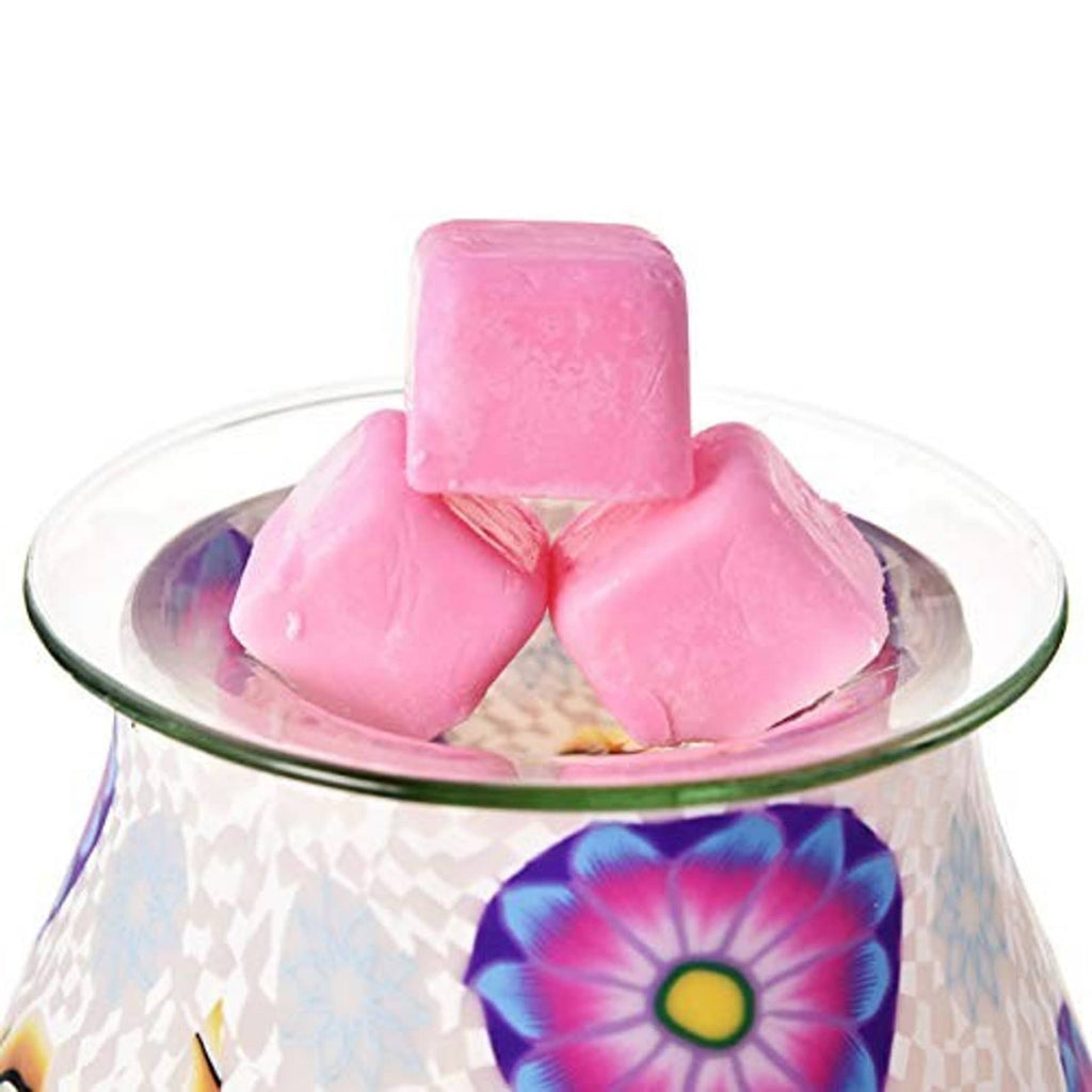 Round glass wax warmer liner dish with pink wax cubes on top