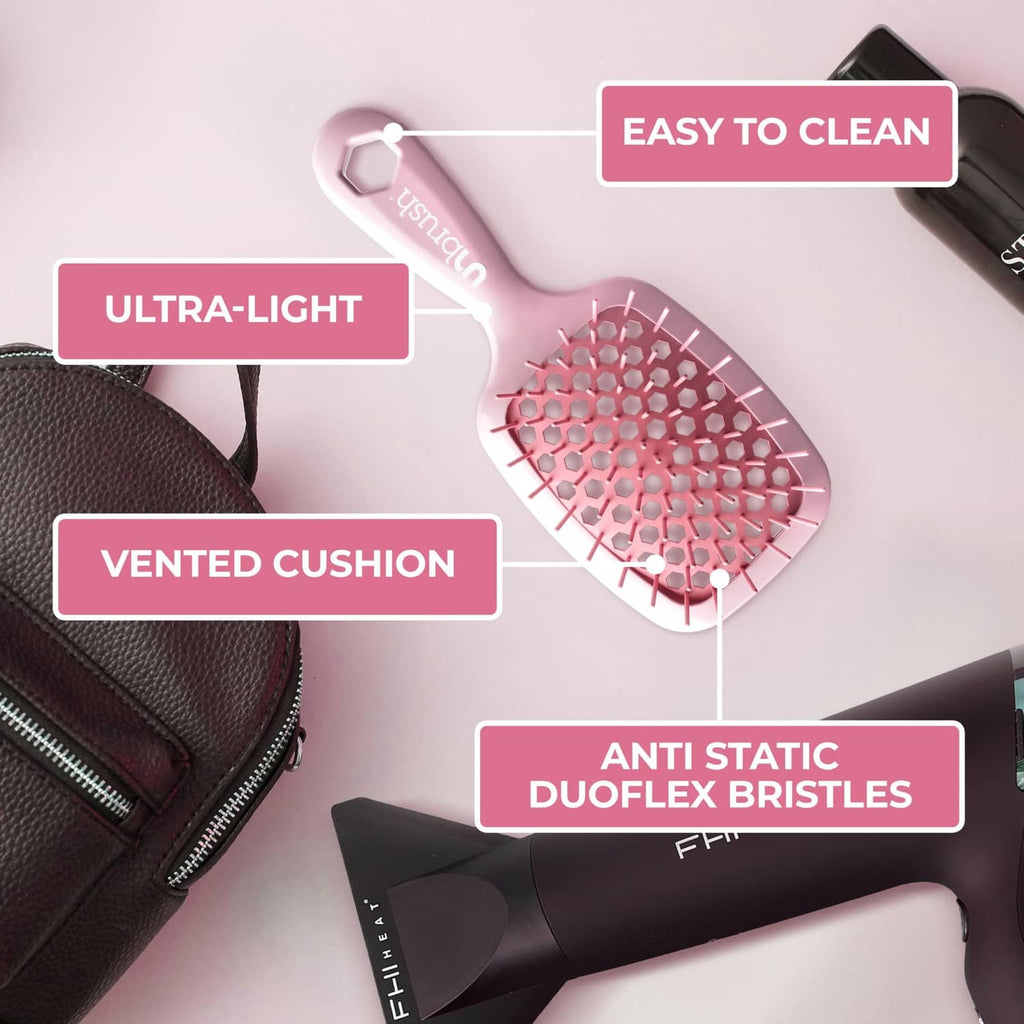 Light pink detangler brush with vented cushion and pink anti-static bristles