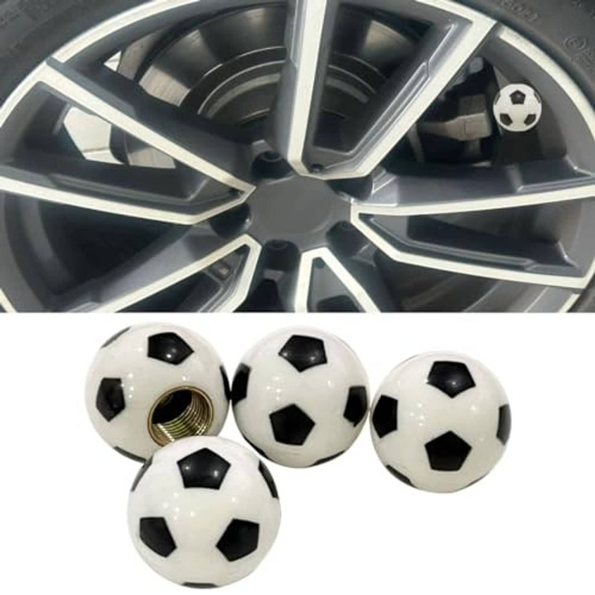 Soccer ball valve stem cap on a car wheel rim, black and white design with brass thread base.