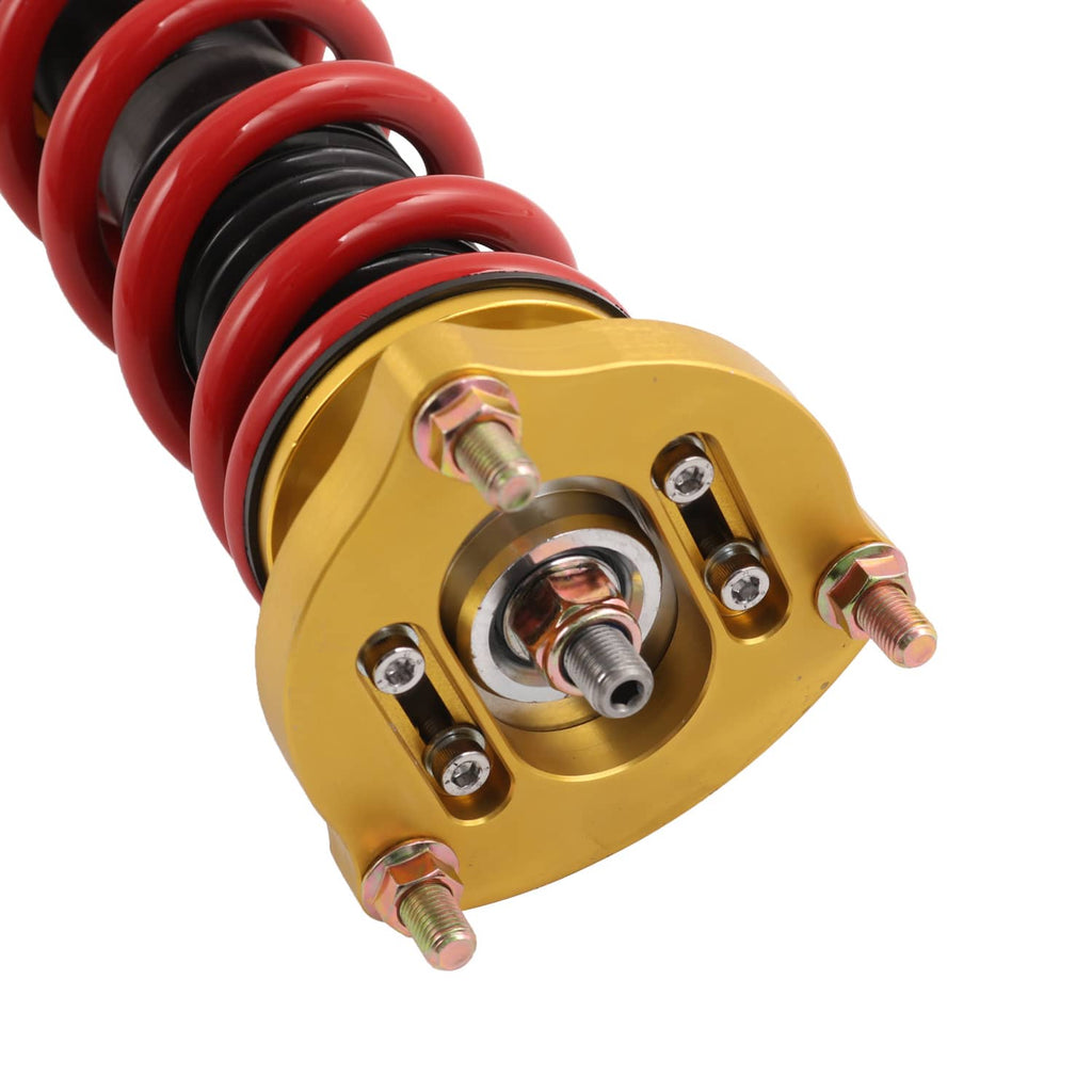 Coilover top mount with red spring, gold housing, and metal adjustment hardware