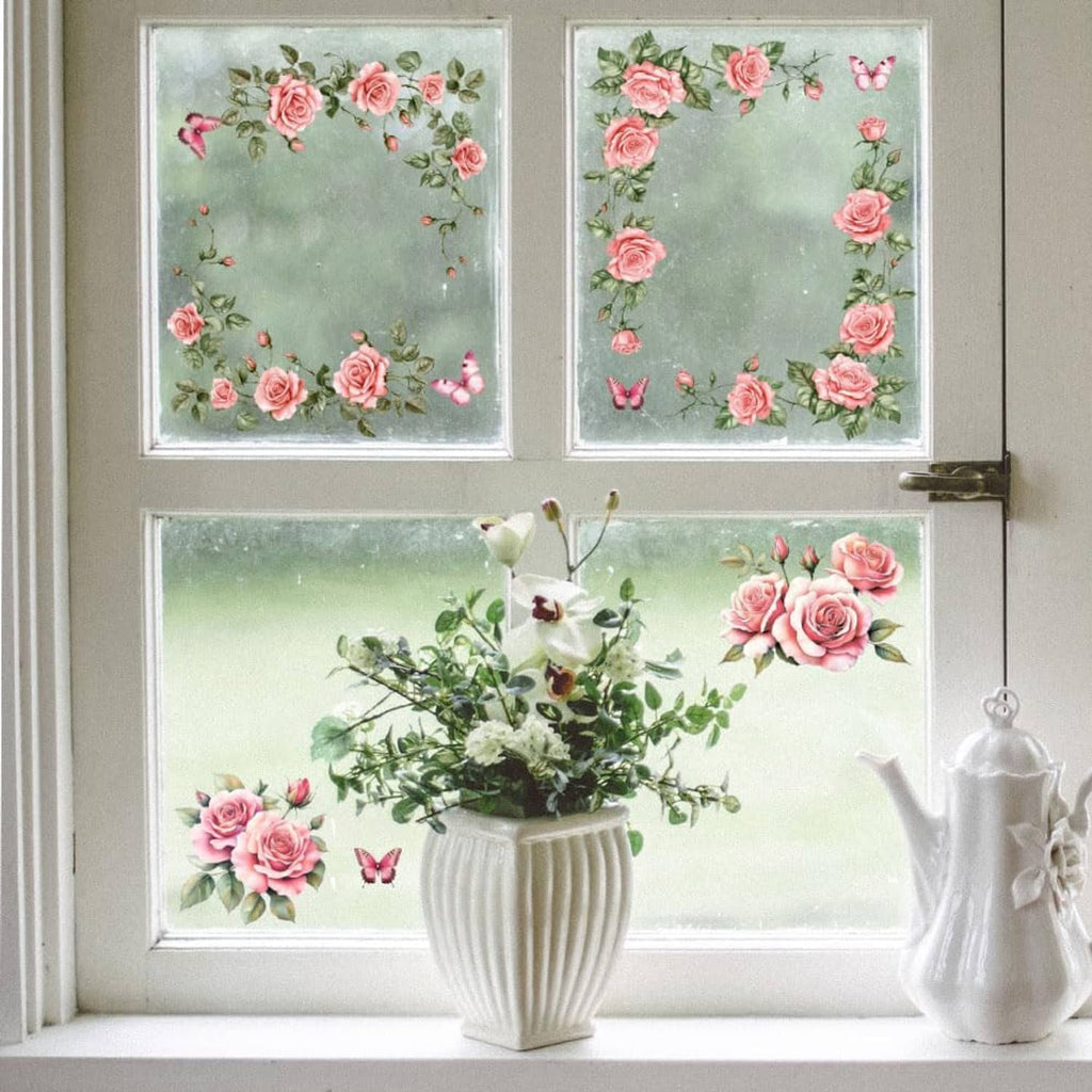 Pink rose and leaf transfer stickers on window glass panels