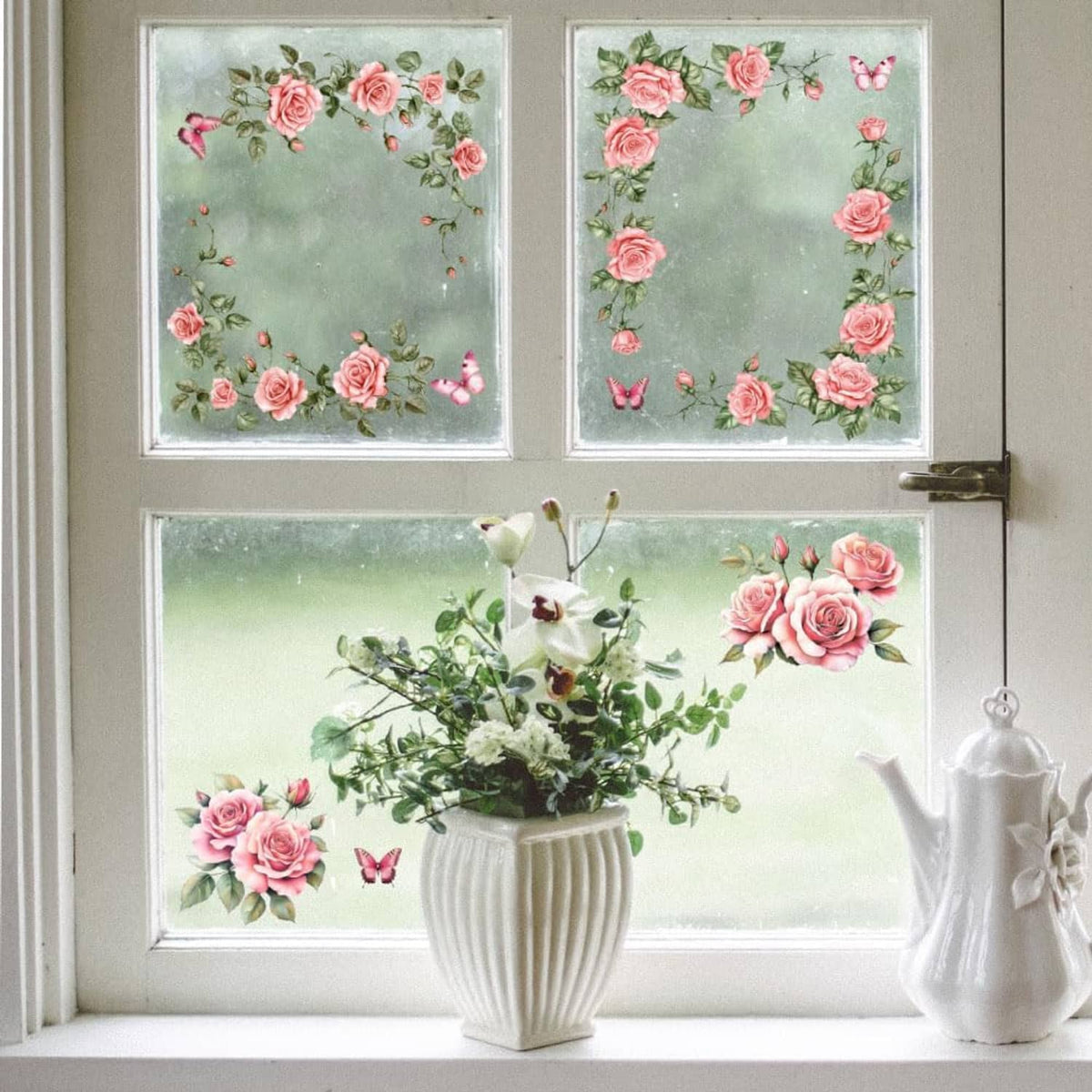 Pink rose and leaf transfer stickers on window glass panels