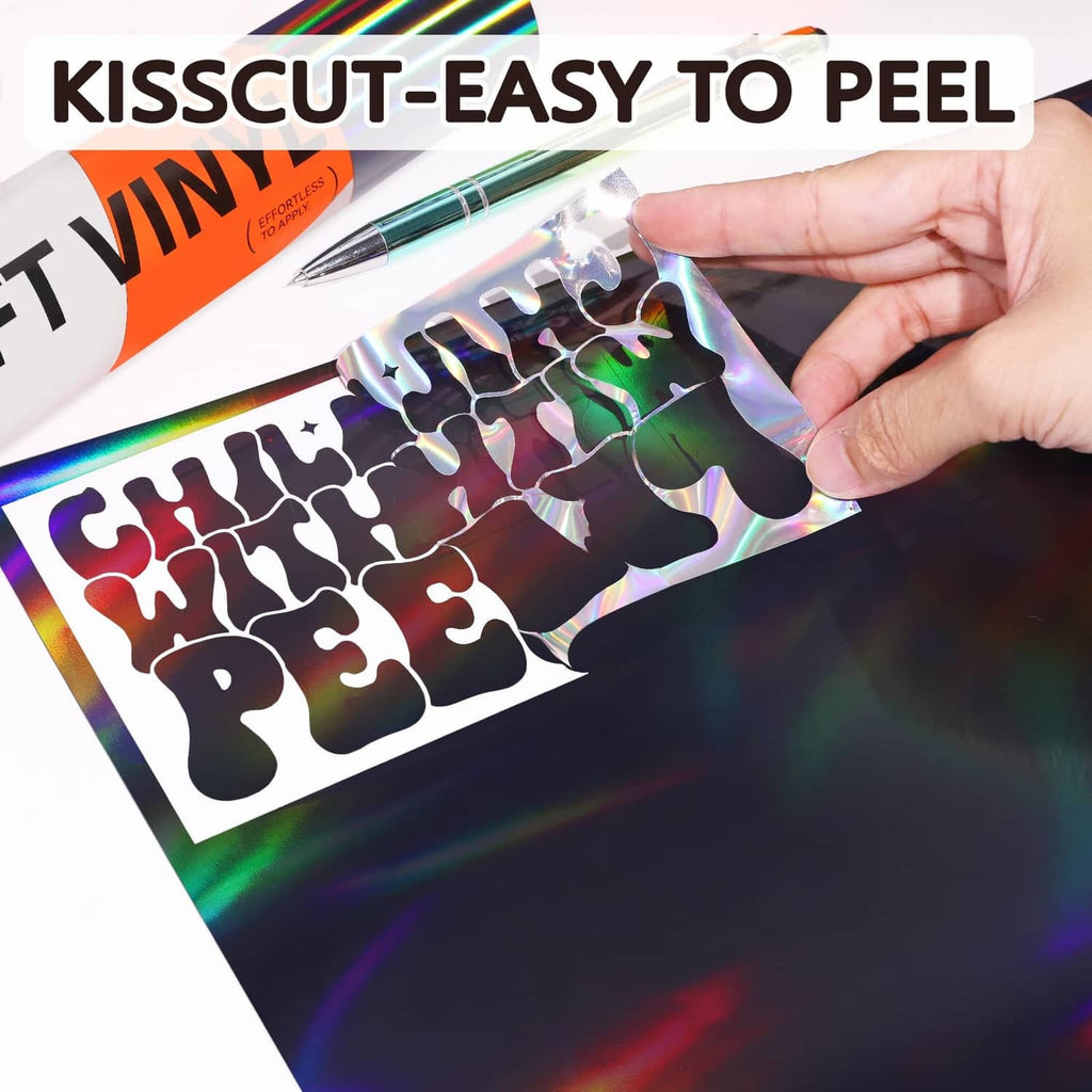 Holographic vinyl sheet being peeled, glossy black film with rainbow iridescent print