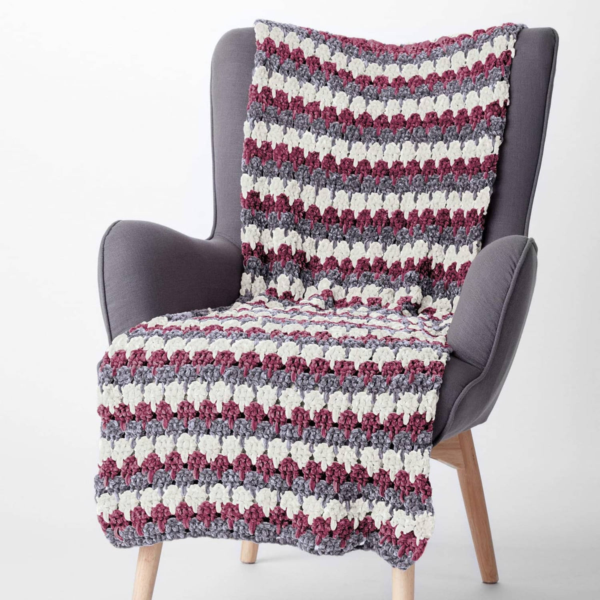Super bulky striped chenille afghan on chair, white, gray, maroon