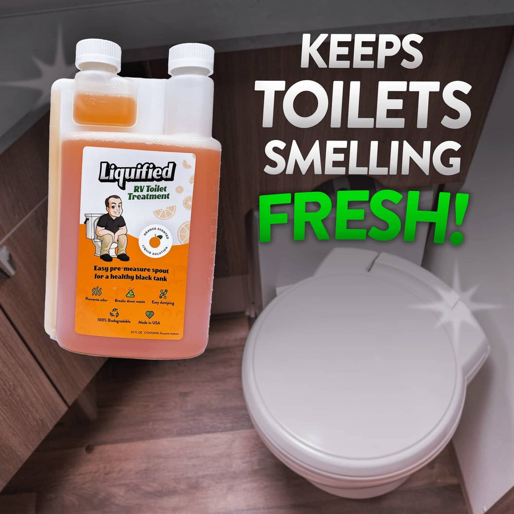 Liquified RV toilet treatment bottle with orange liquid beside closed RV toilet lid