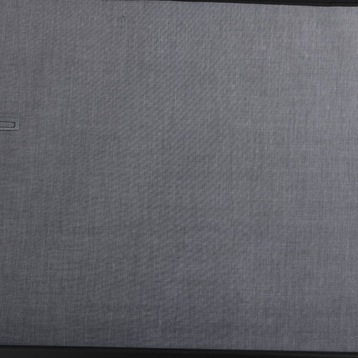 Rear trunk security shade panel, textured gray fabric surface
