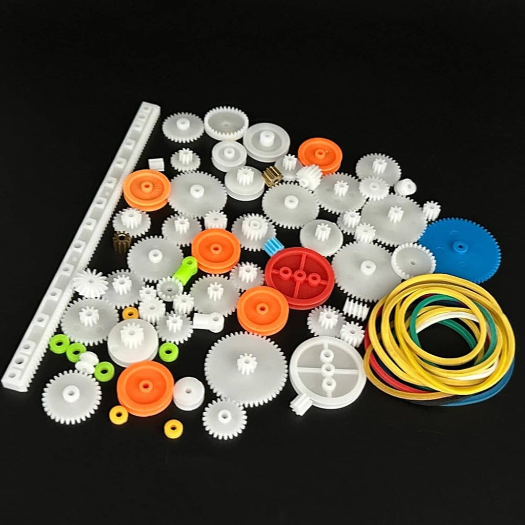 Plastic gear and pulley kit showing white gears, orange/red parts, and colored belt