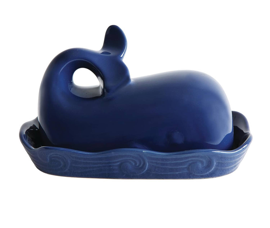 Dark blue whale-shaped lid for butter dish with circular cutout opening