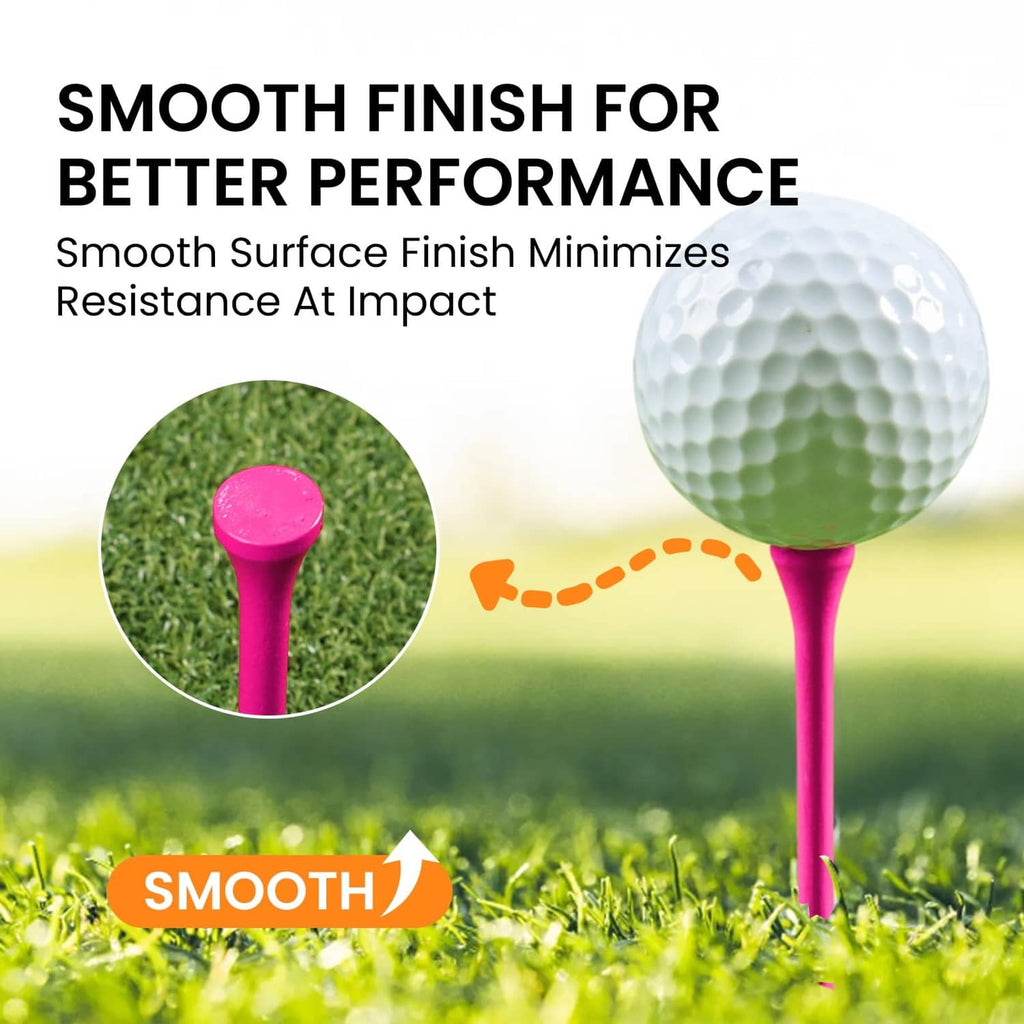 Pink-topped wooden golf tee on grass beside a golf ball