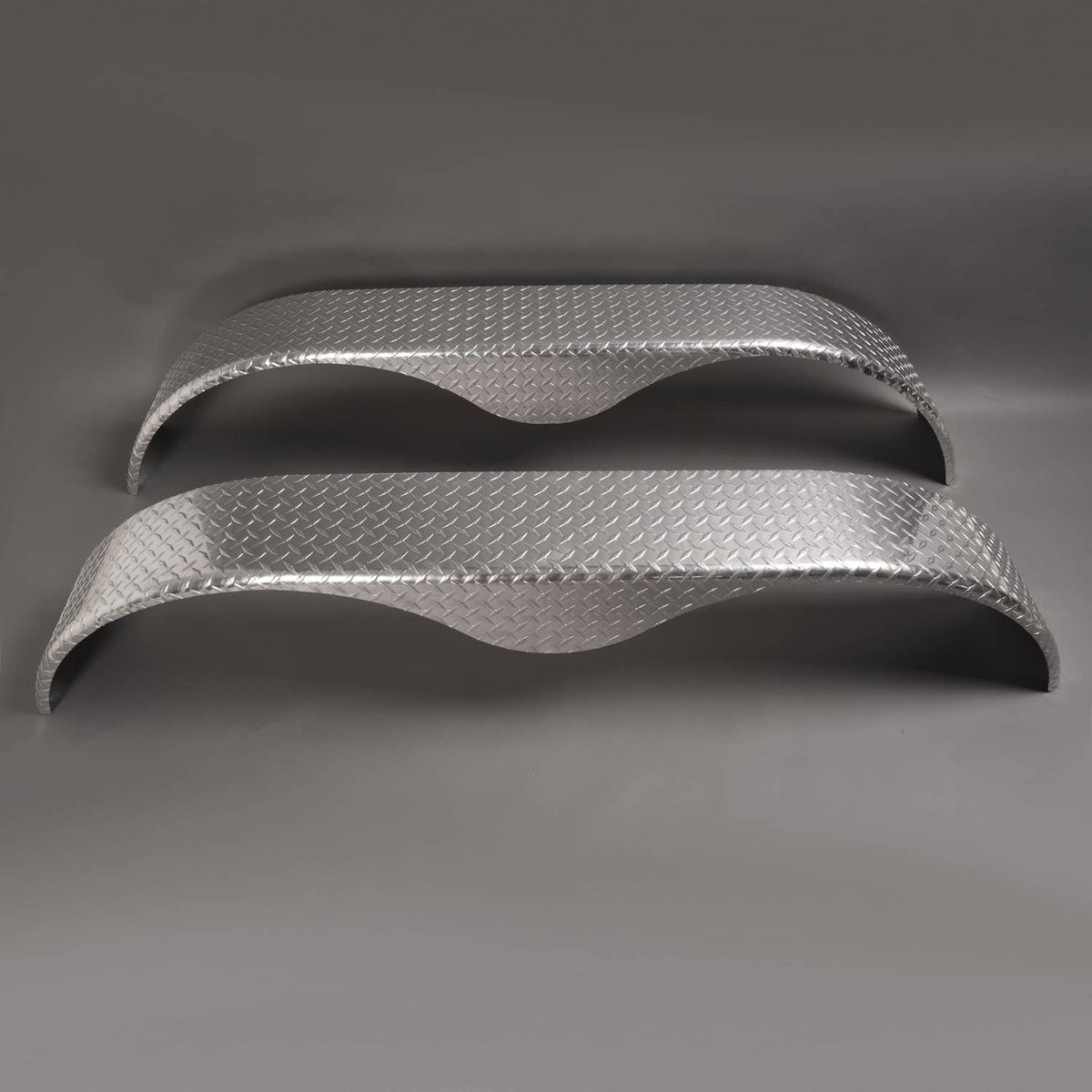 Silver teardrop tread plate trailer fender set, close view of curved profiles and edge