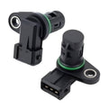 Pair of black camshaft position sensors with green O-ring and circular mounting hole