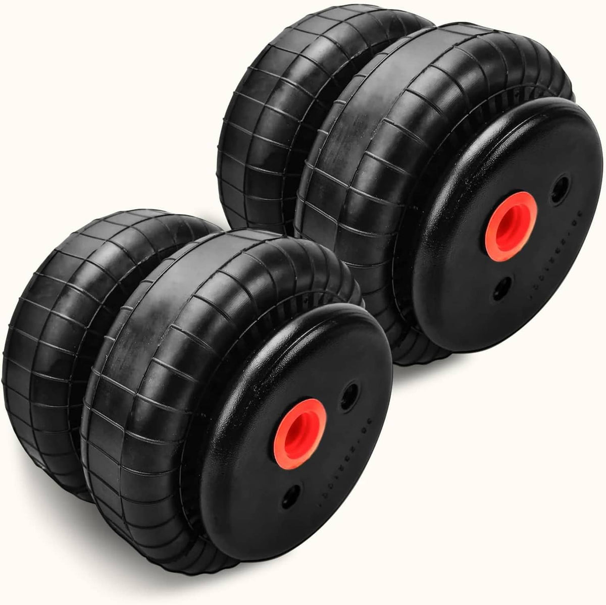 Two black air suspension bags with round end caps and red air valve ports