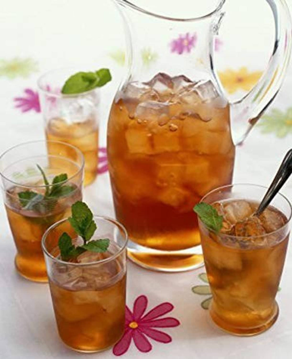 DaVinci Irish cream syrup pitcher and glasses with amber-colored drink
