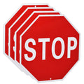 Set of octagonal red stop signs with white STOP lettering and border