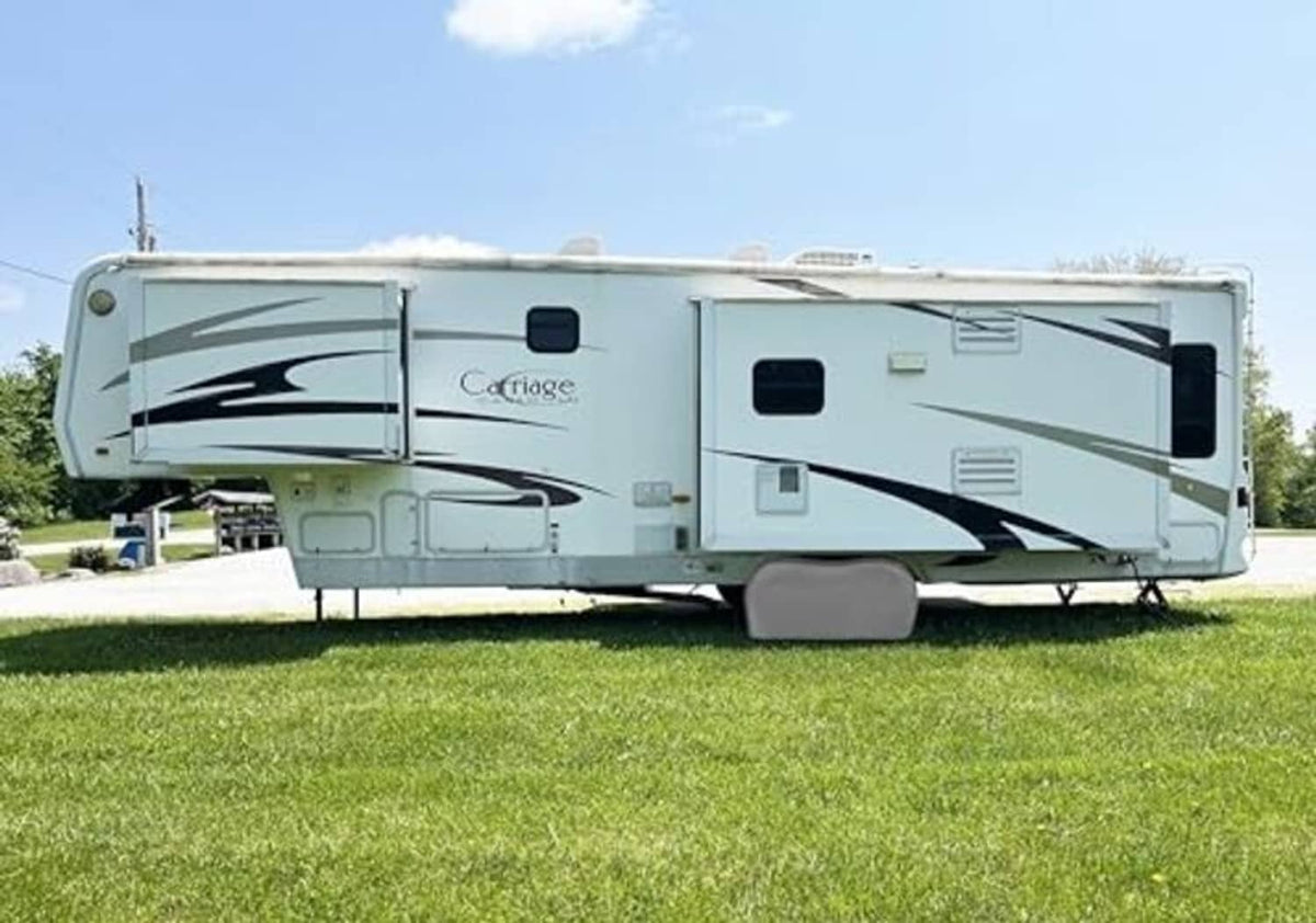 Camper trailer with dual wheel tire cover area not clearly visible from this angle