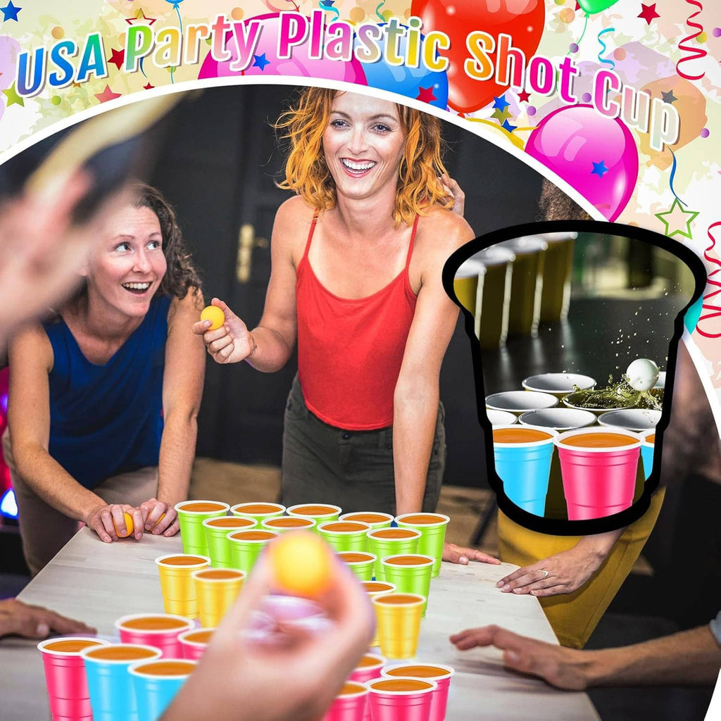 Colorful 2 oz plastic shot cups on a party table with hands serving
