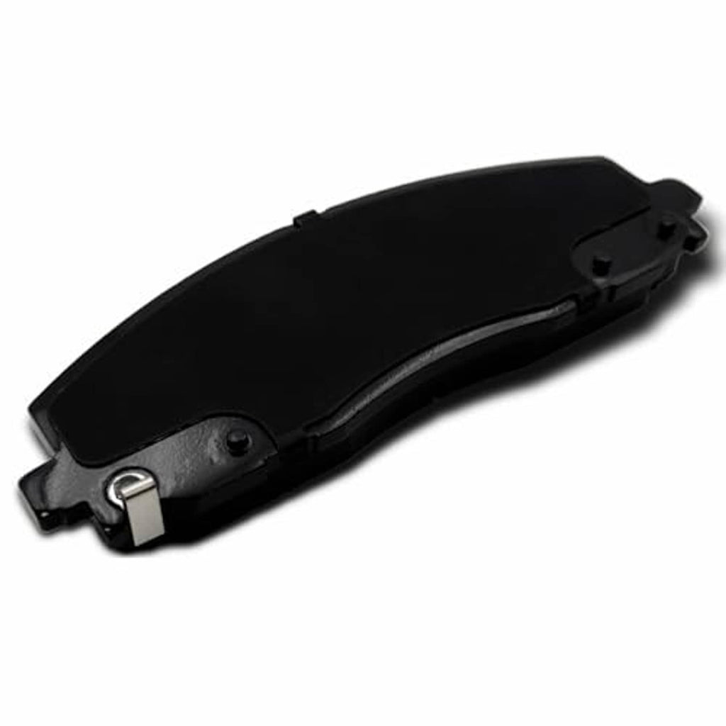 Ceramic brake pad showing black backing plate with gray friction edge, angled view