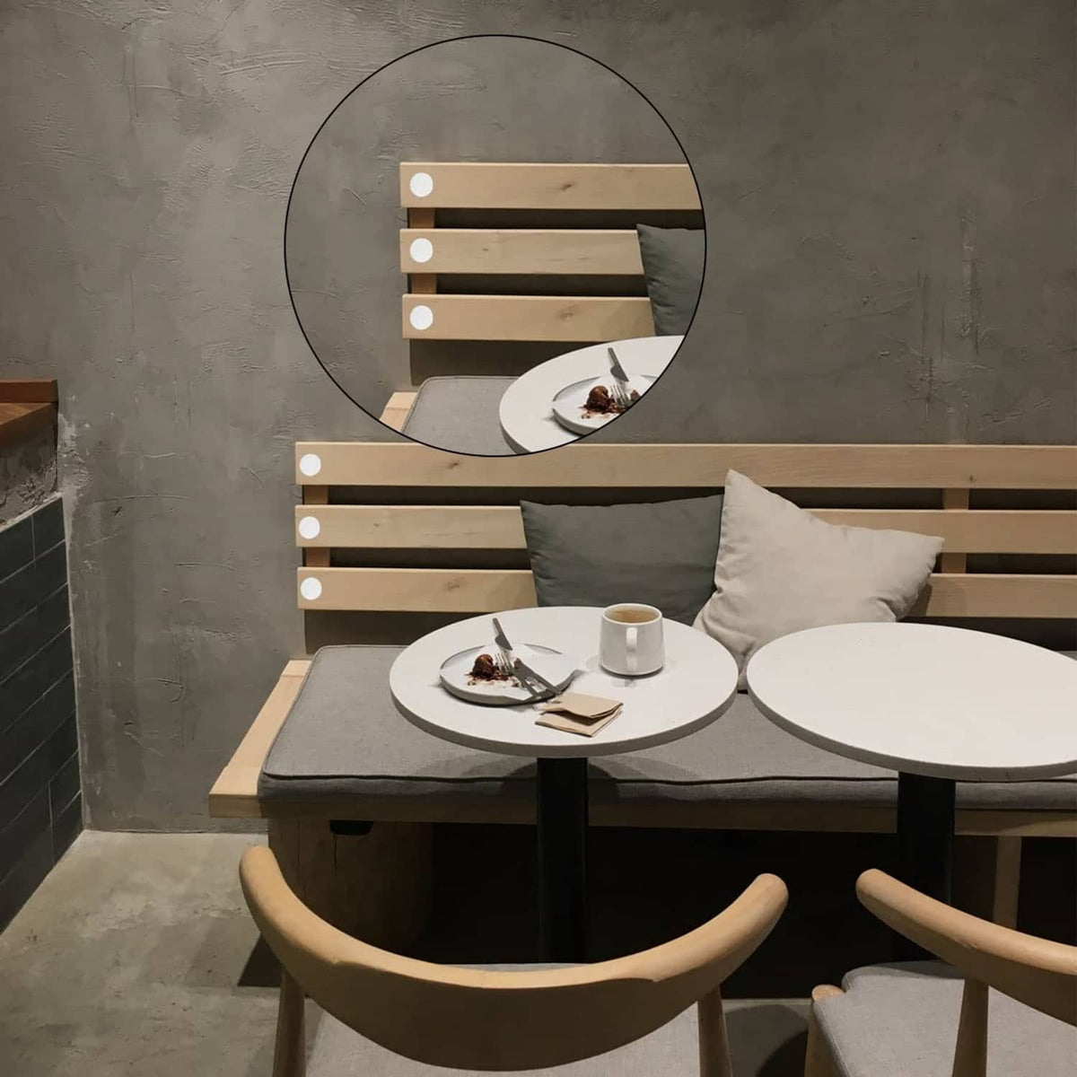 White plastic plugs on wooden bench slats and dining table legs