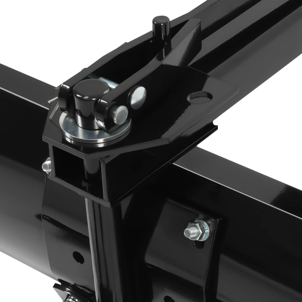 Close-up of black pivot and mounting hardware on tow-behind scraper blade frame