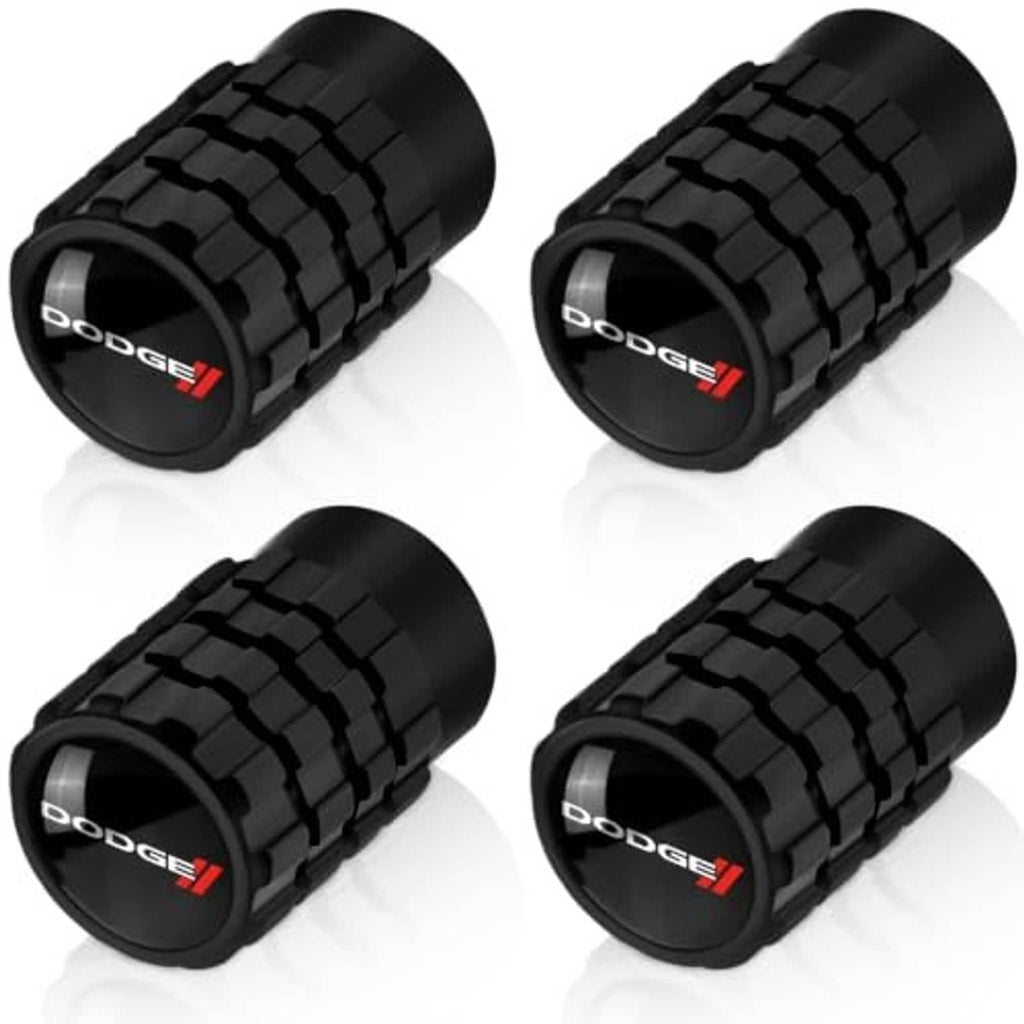 Four black tire valve stem caps, textured grip style with Dodge logo on each cap